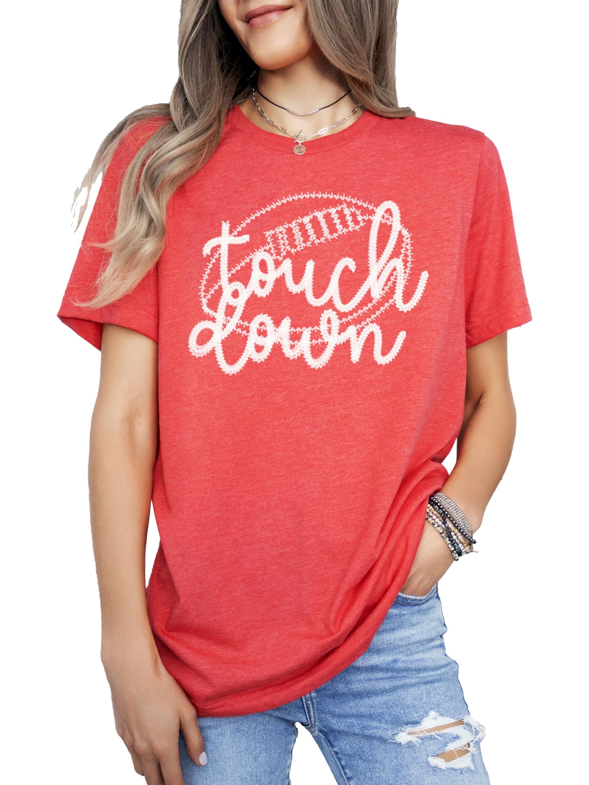 Woman wearing black touchdown football graphic tee showing fit and style
