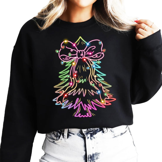 Black pullover sweatshirt with vibrant neon Christmas tree graphic, festive bow, and colorful lights design