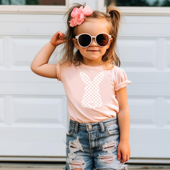 Girls Easter outfit featuring peach checkered bunny graphic tshirt