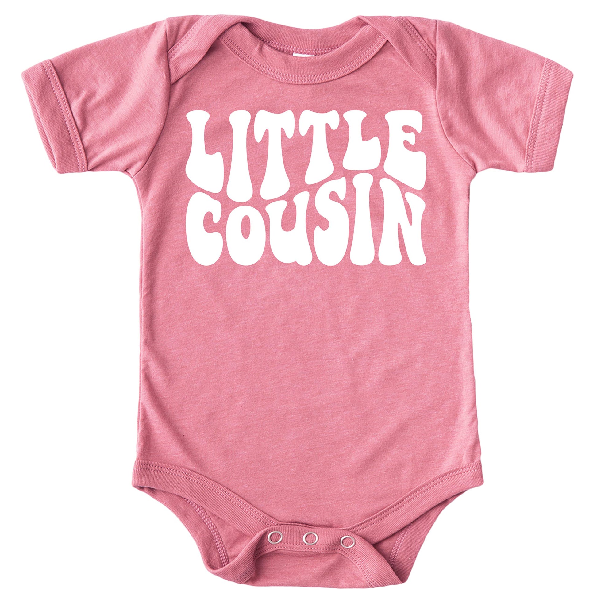 Baby modeling Little Cousin groovy bodysuit in natural lighting