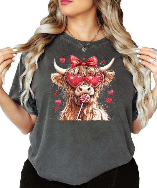 Close-up of Highland Cow Valentine's Day tee showing detailed hearts and candy print
