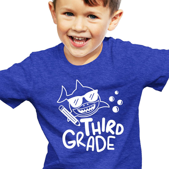 Full product shot of 3rd grade shark tee laid flat showing youth fit