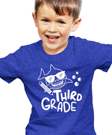 Full product shot of 3rd grade shark tee laid flat showing youth fit