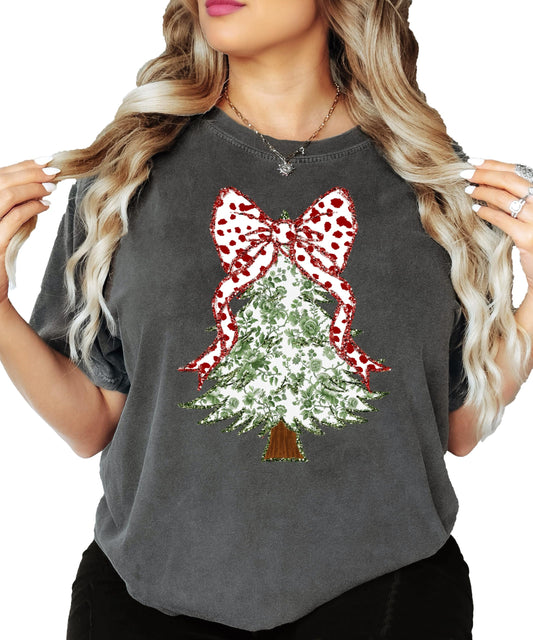 Front view of women's Christmas graphic tee featuring a faux glitter floral tree with red dot bow on top