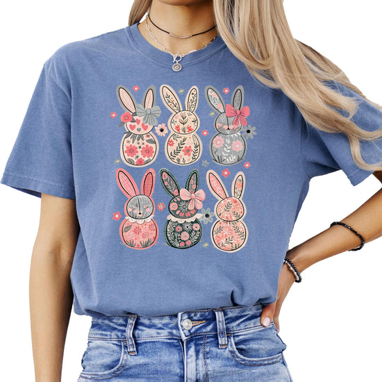 Close-up of retro floral Easter bunny print on ivory women's graphic tee with vintage-style bow details