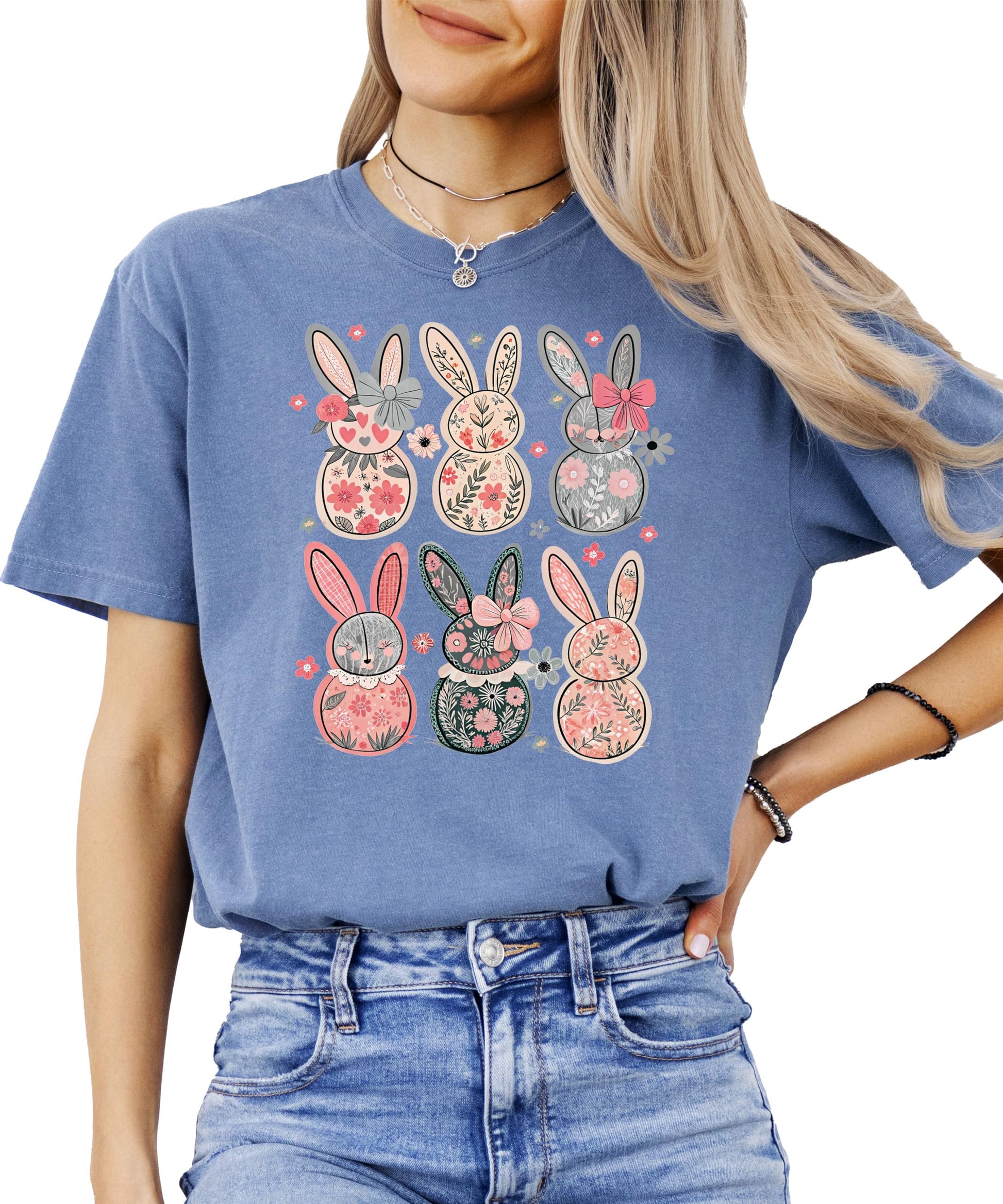 Close-up of retro floral Easter bunny print on ivory women's graphic tee with vintage-style bow details