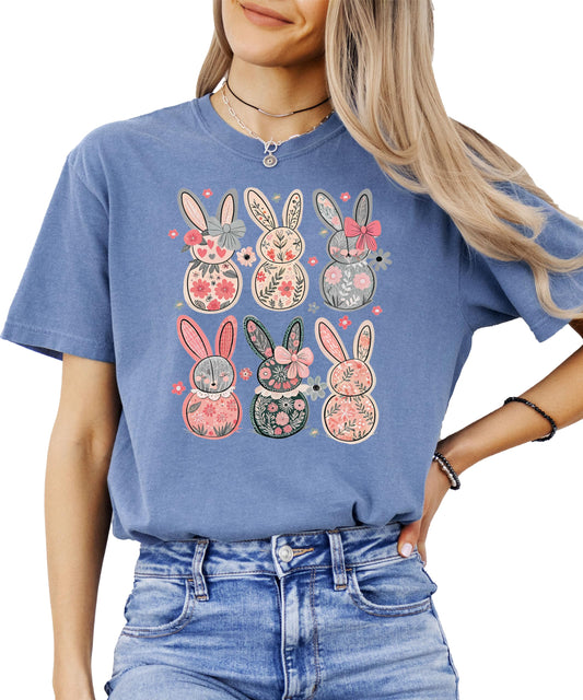 Close-up of retro floral Easter bunny print on ivory women's graphic tee with vintage-style bow details