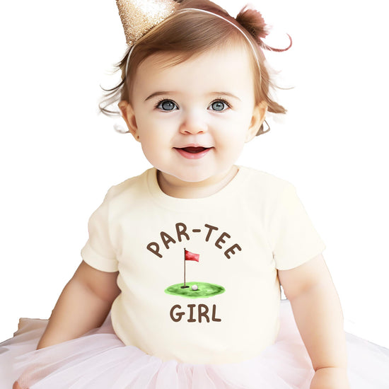Close-up of Par-Tee Girl golf-themed birthday graphic print on kids natural tee