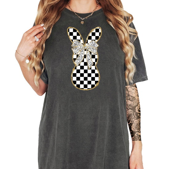 Flat lay of black and white checkered bunny graphic tee shirt