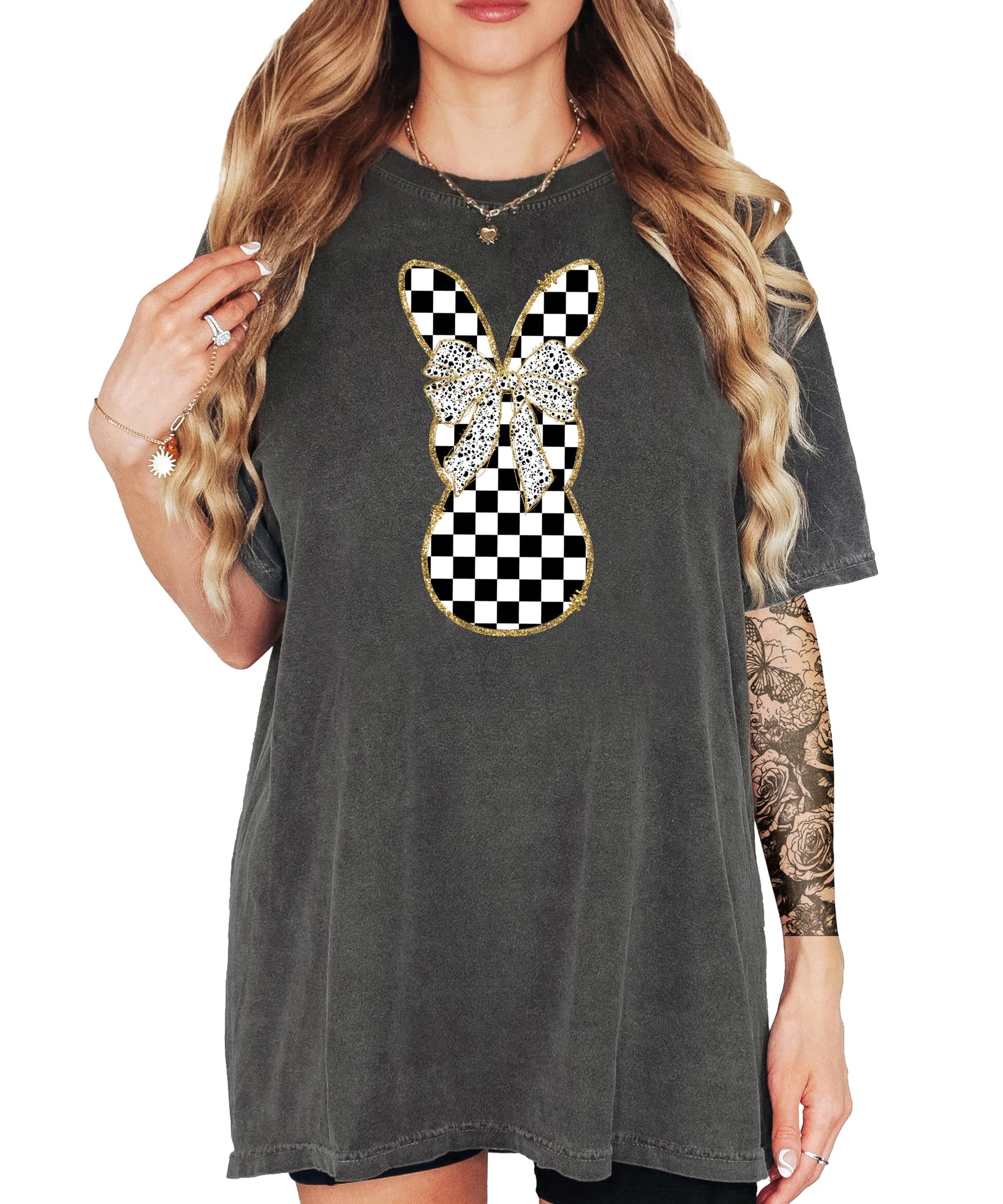 Flat lay of black and white checkered bunny graphic tee shirt