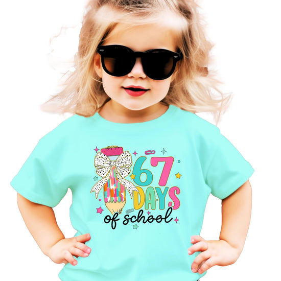 Kids' 67 Days of School graphic tee featuring a cute pencil with a pink coquette bow and the 6-7 meme design