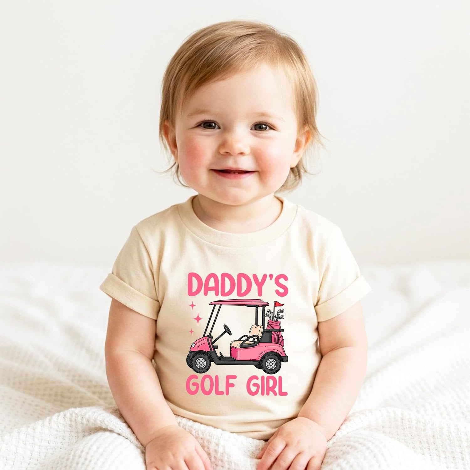 Close-up of Daddy's Golf Girl screen-printed graphic on a soft cotton toddler tee