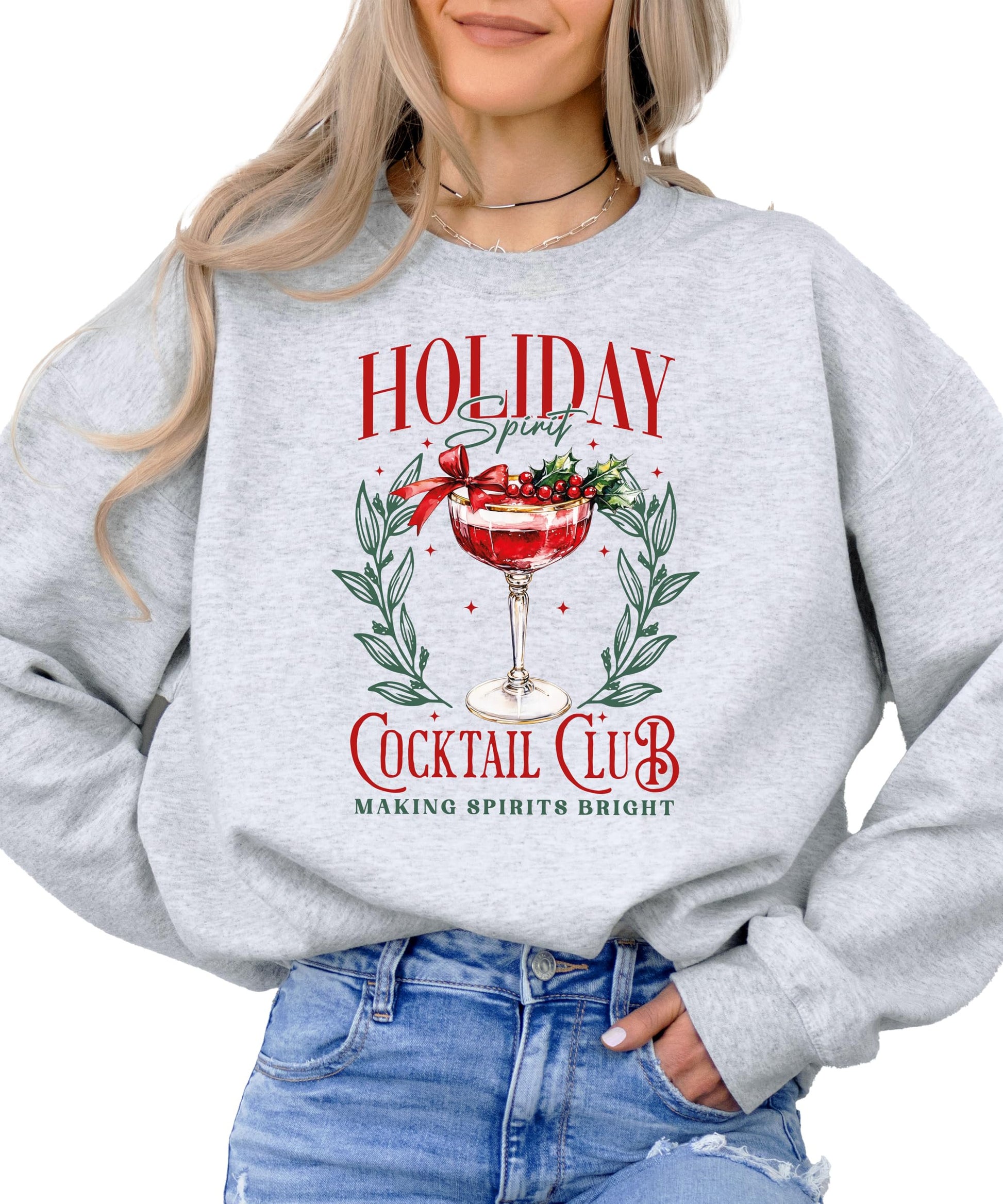 Close-up of Holiday Spirit Cocktail Club Christmas sweatshirt graphic print on gray fabric