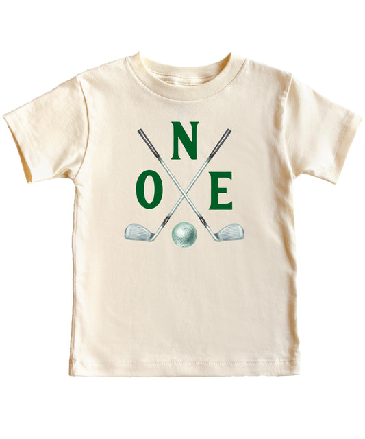 Golf themed 1st birthday matching family shirt set displayed together for party photo shoot