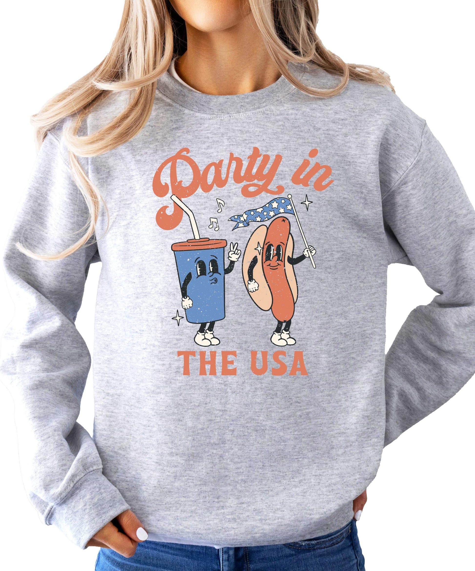 Women wearing Party In The USA white graphic sweatshirt for Fourth of July celebration