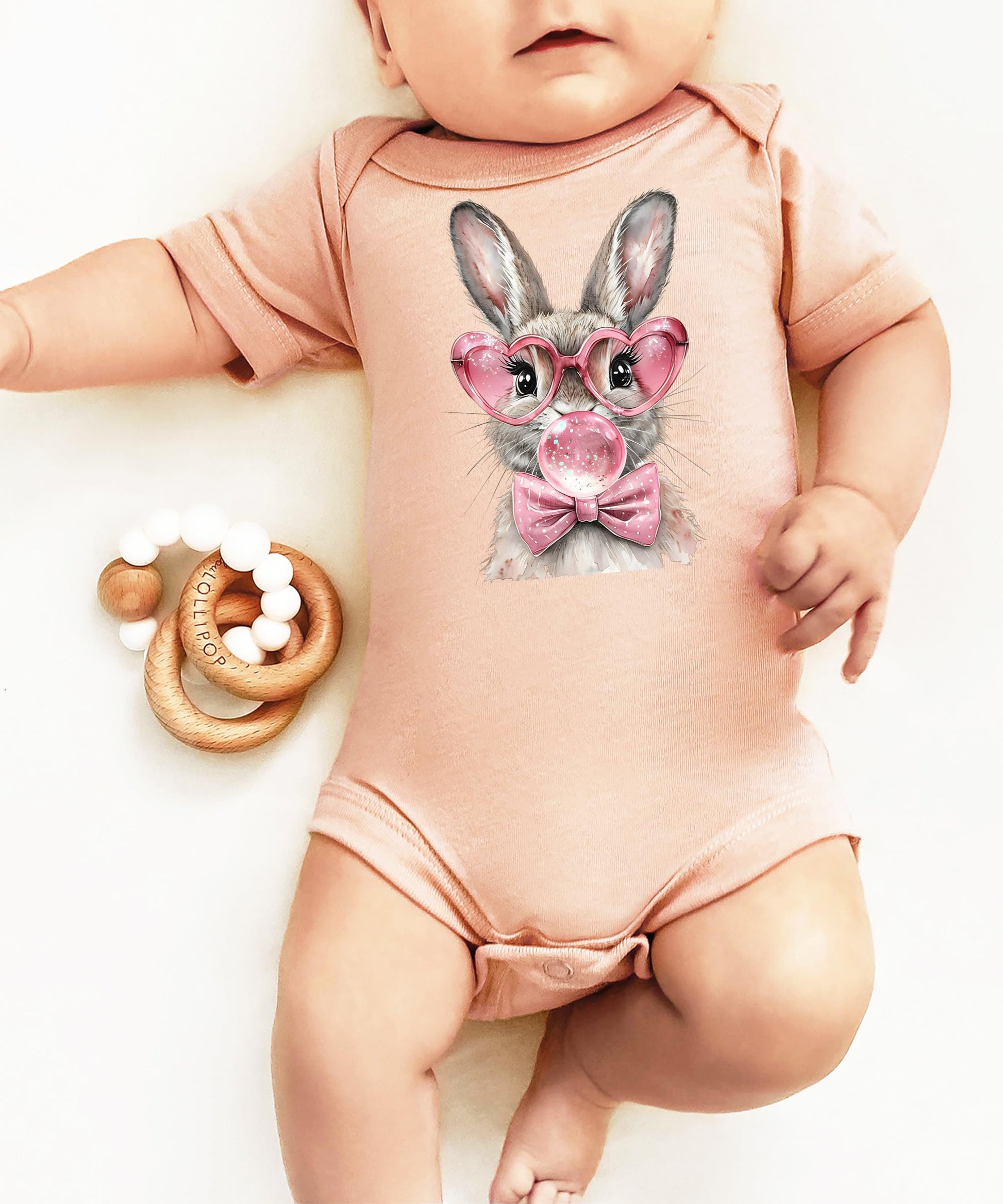 Easter bunny bubblegum onesie for baby girls laid flat on neutral background showing full design