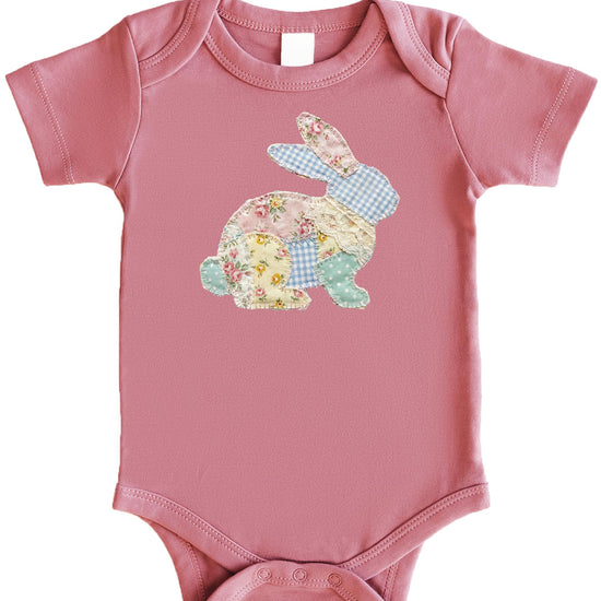Close-up of faux quilted patchwork bunny graphic printed on baby bodysuit
