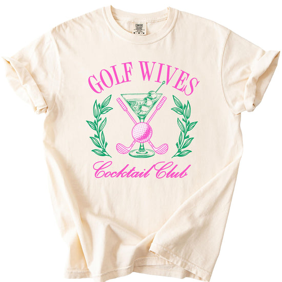 Lifestyle flat lay of ivory Golf Wives Cocktail Club funny women's graphic tee by Olive Loves Apple