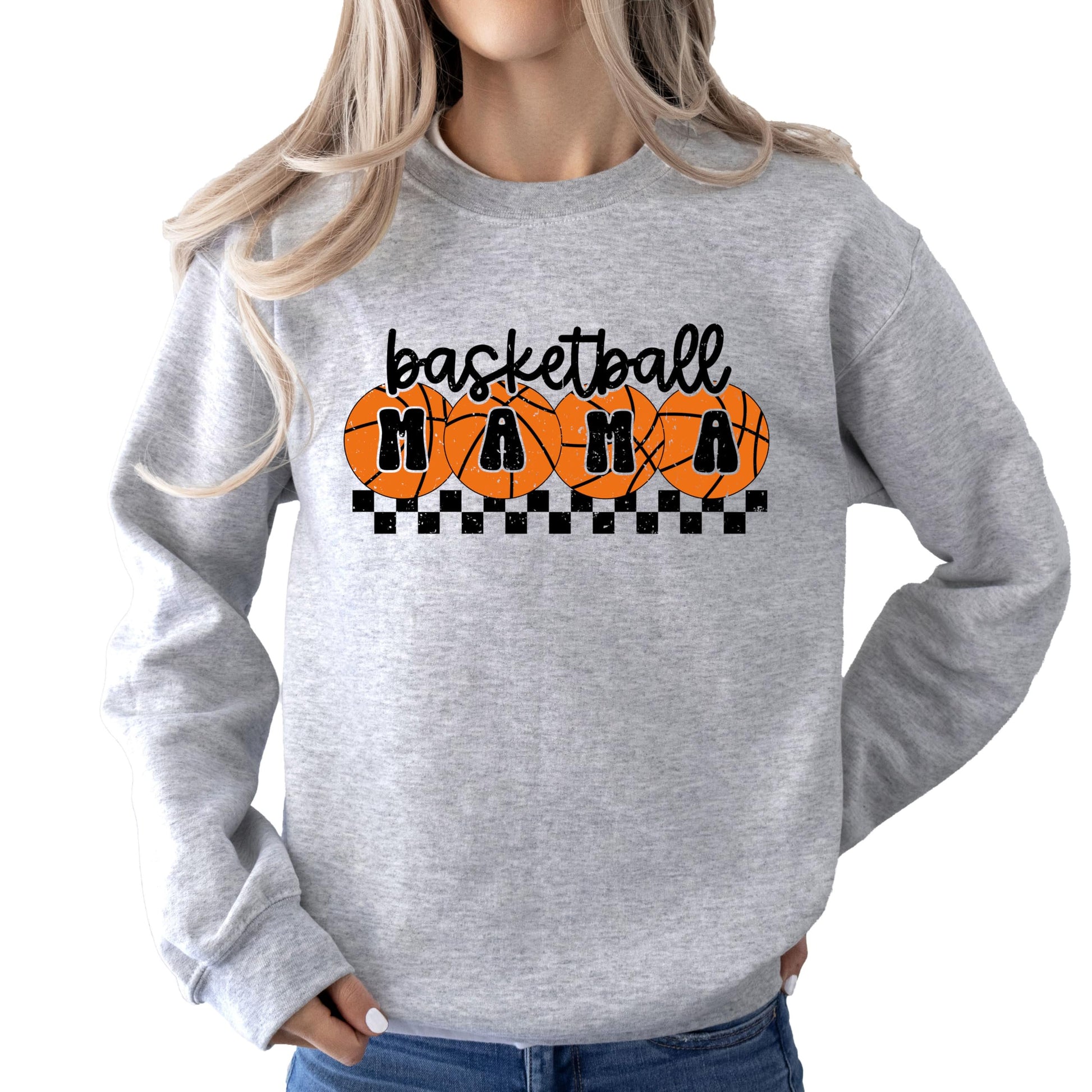 Close-up of orange checkered basketball mama design on white sweatshirt