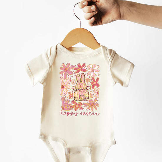 Baby girl Easter bodysuit folded showing full bunny and floral print detail