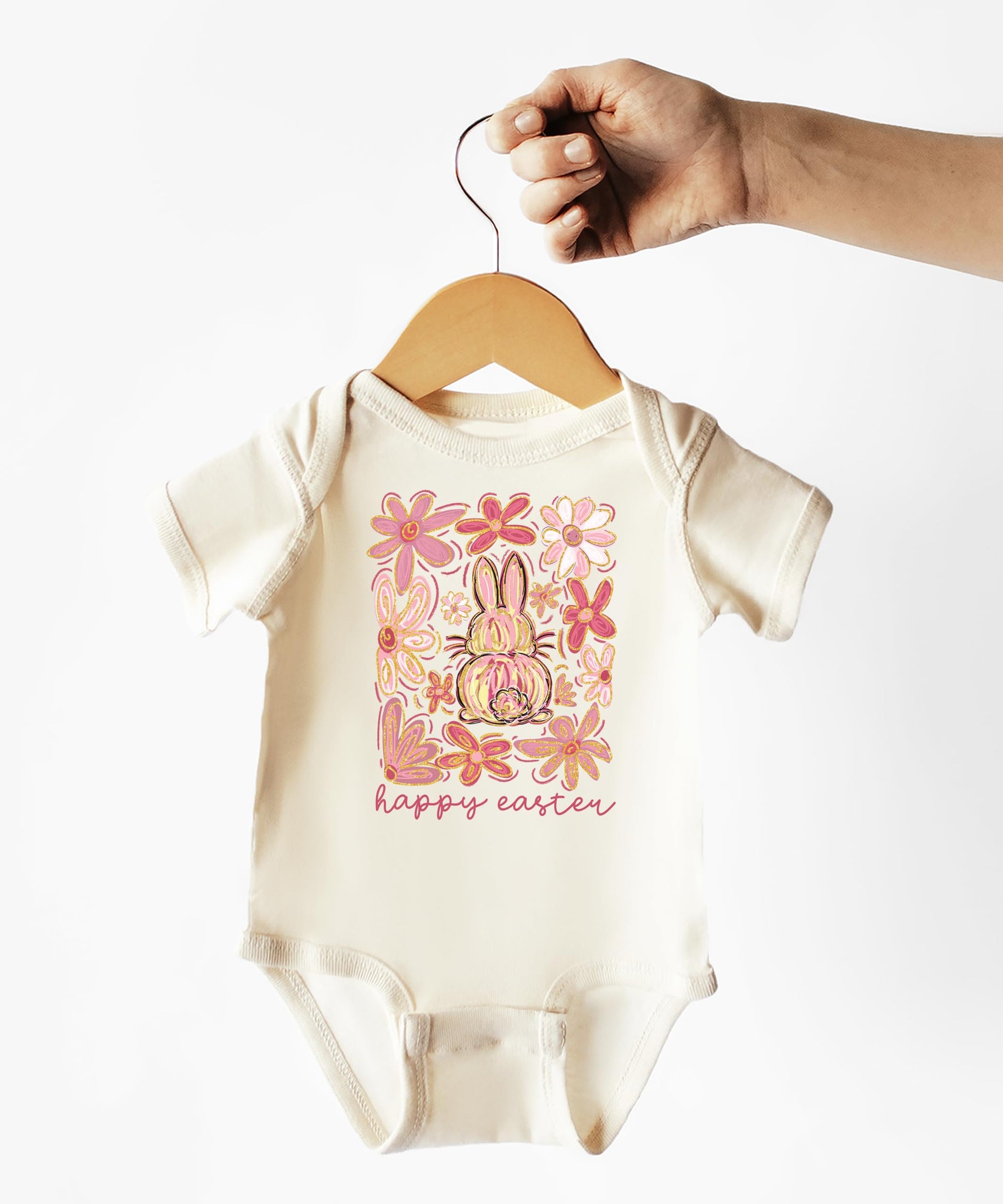 Baby girl Easter bodysuit folded showing full bunny and floral print detail
