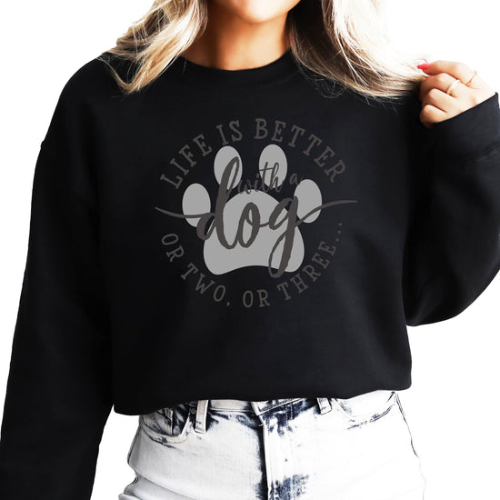 Model wearing white dog mom graphic sweatshirt, casual everyday style