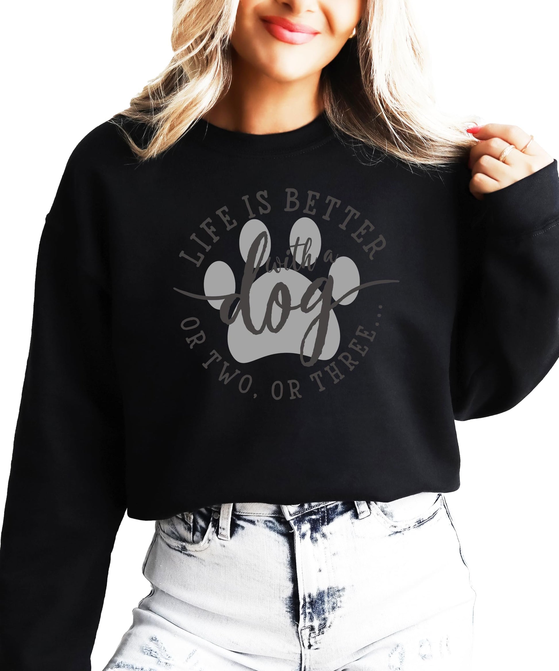 Model wearing white dog mom graphic sweatshirt, casual everyday style
