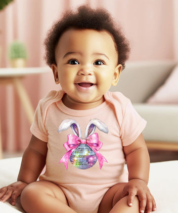 Close-up of Olive Loves Apple disco bunny Easter one-piece onesie with pink bow and glitter disco ball print