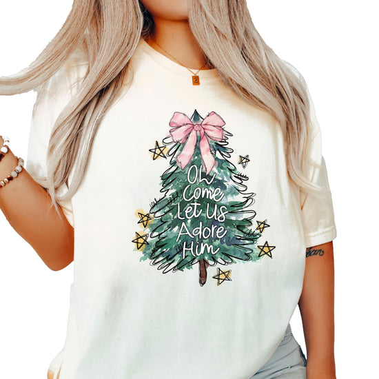 Detail shot of pink bow Christmas tree graphic on seafoam women's holiday tee by Olive Loves Apple