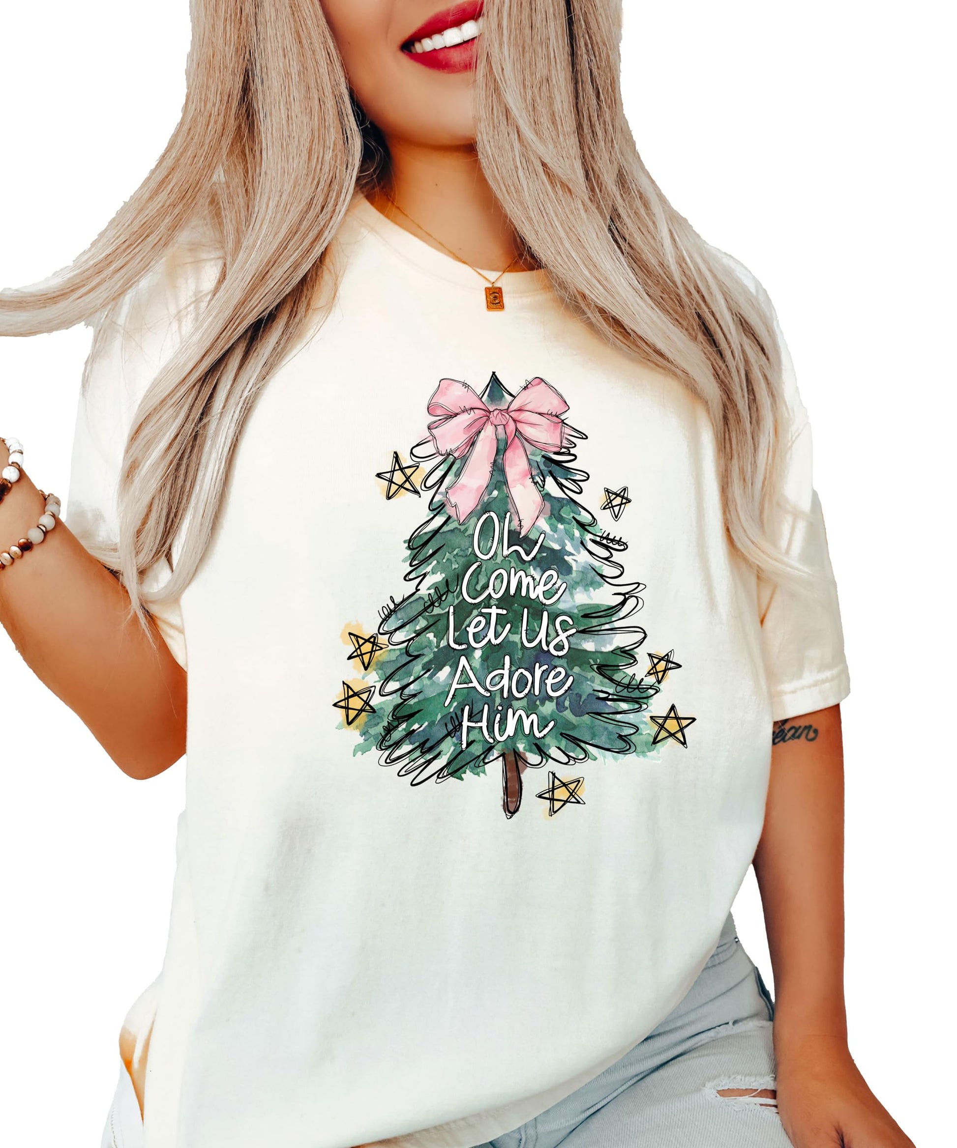 Detail shot of pink bow Christmas tree graphic on seafoam women's holiday tee by Olive Loves Apple