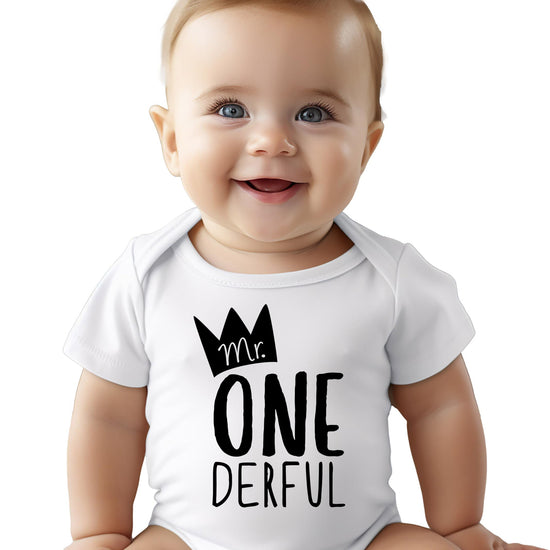 Flat lay of baby boy first birthday bodysuit with One-Derful graphic
