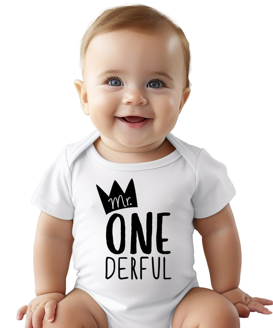 Flat lay of baby boy first birthday bodysuit with One-Derful graphic