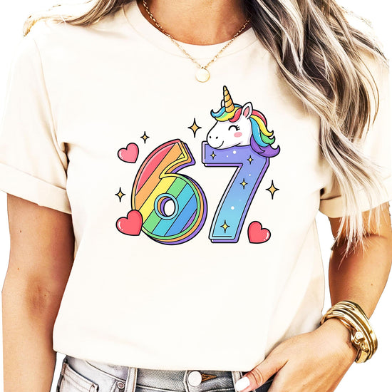 Model wearing pink unicorn 7th birthday shirt with rainbow numbers and magical unicorn graphic