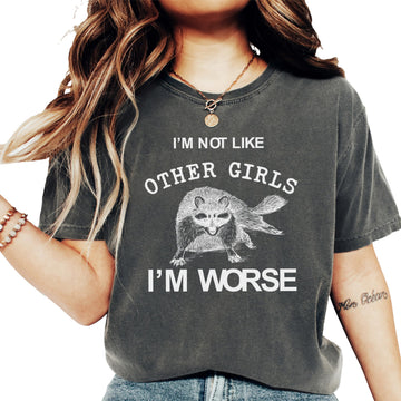 Ivory women's graphic tee with raccoon and text 'I'm Not Like Other Girls I'm Worse' by Olive Loves Apple