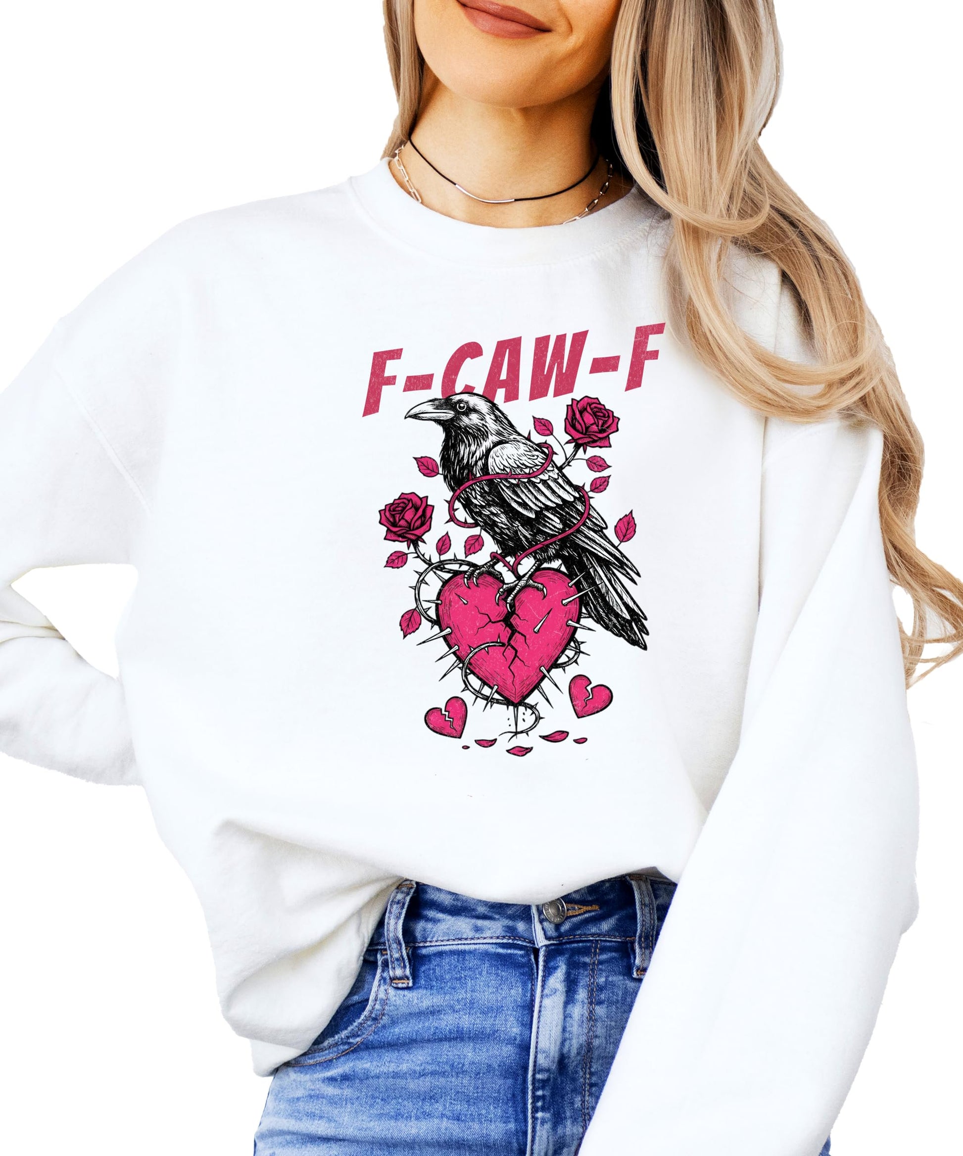 Women's white crewneck sweatshirt with black crow over a broken heart and F-Caw-F text graphic