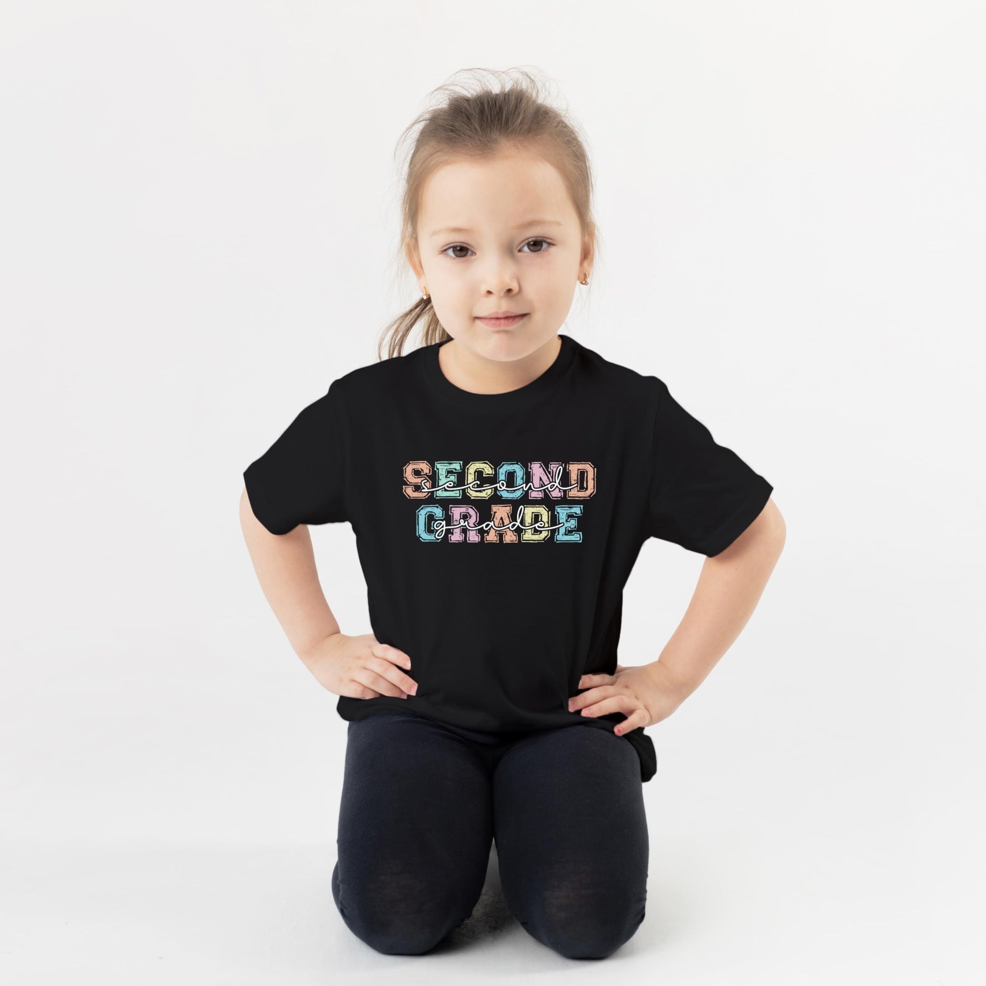Close-up view of second grade shirt showing vibrant pastel font design details