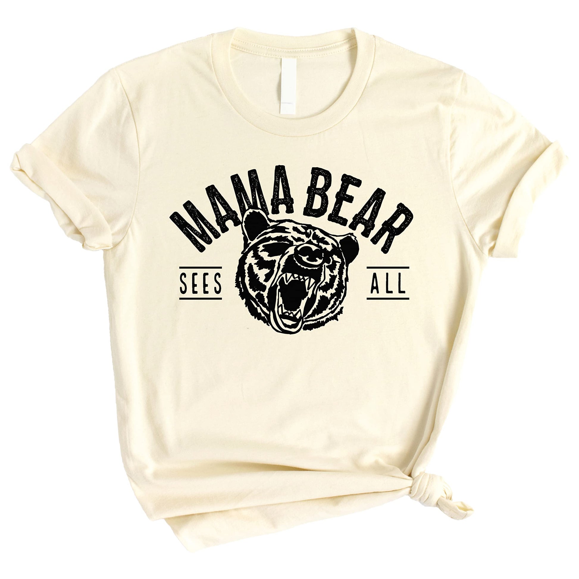 Close-up of Mama Bear Sees All design printed in black on peach womens tee