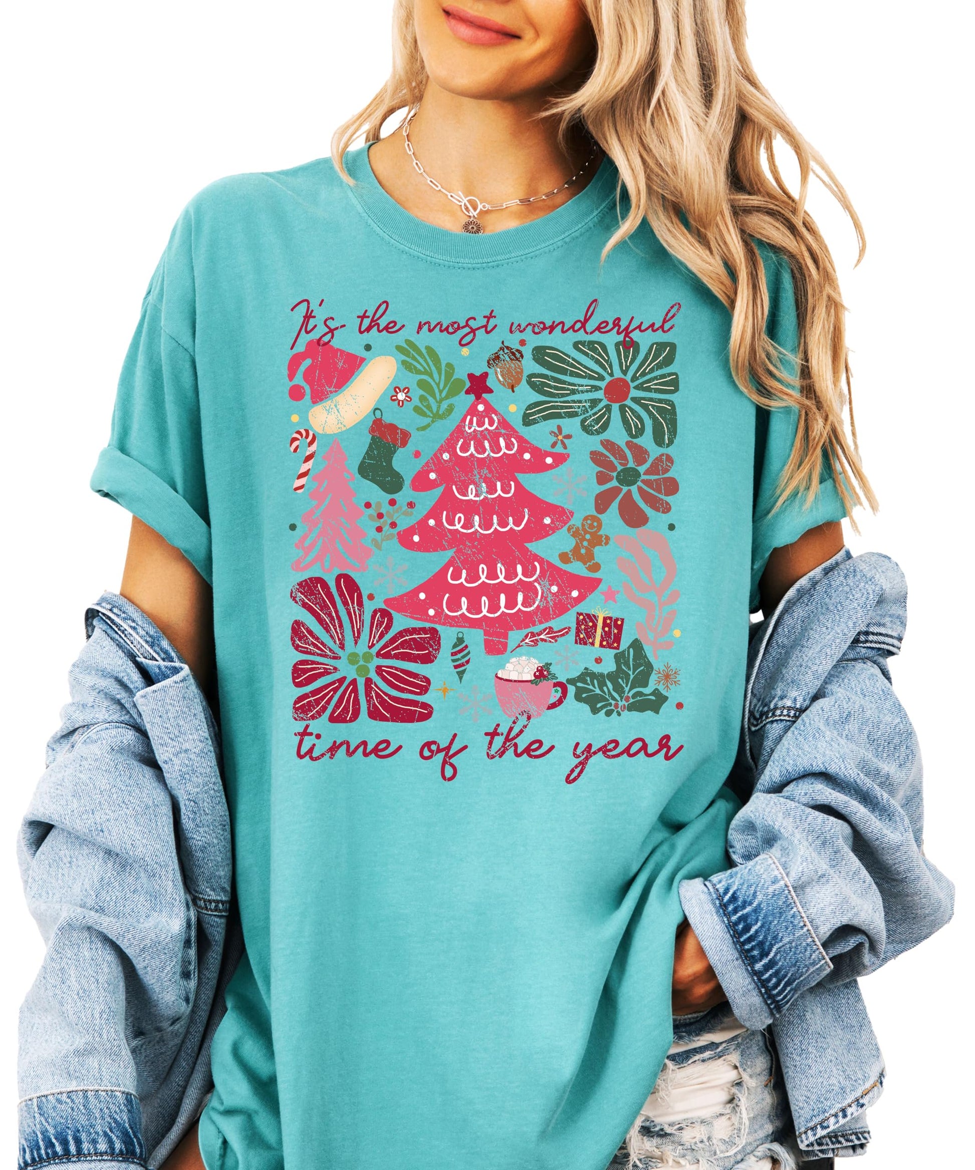 Model wearing ivory holiday graphic tee with Christmas collage print, casual styling