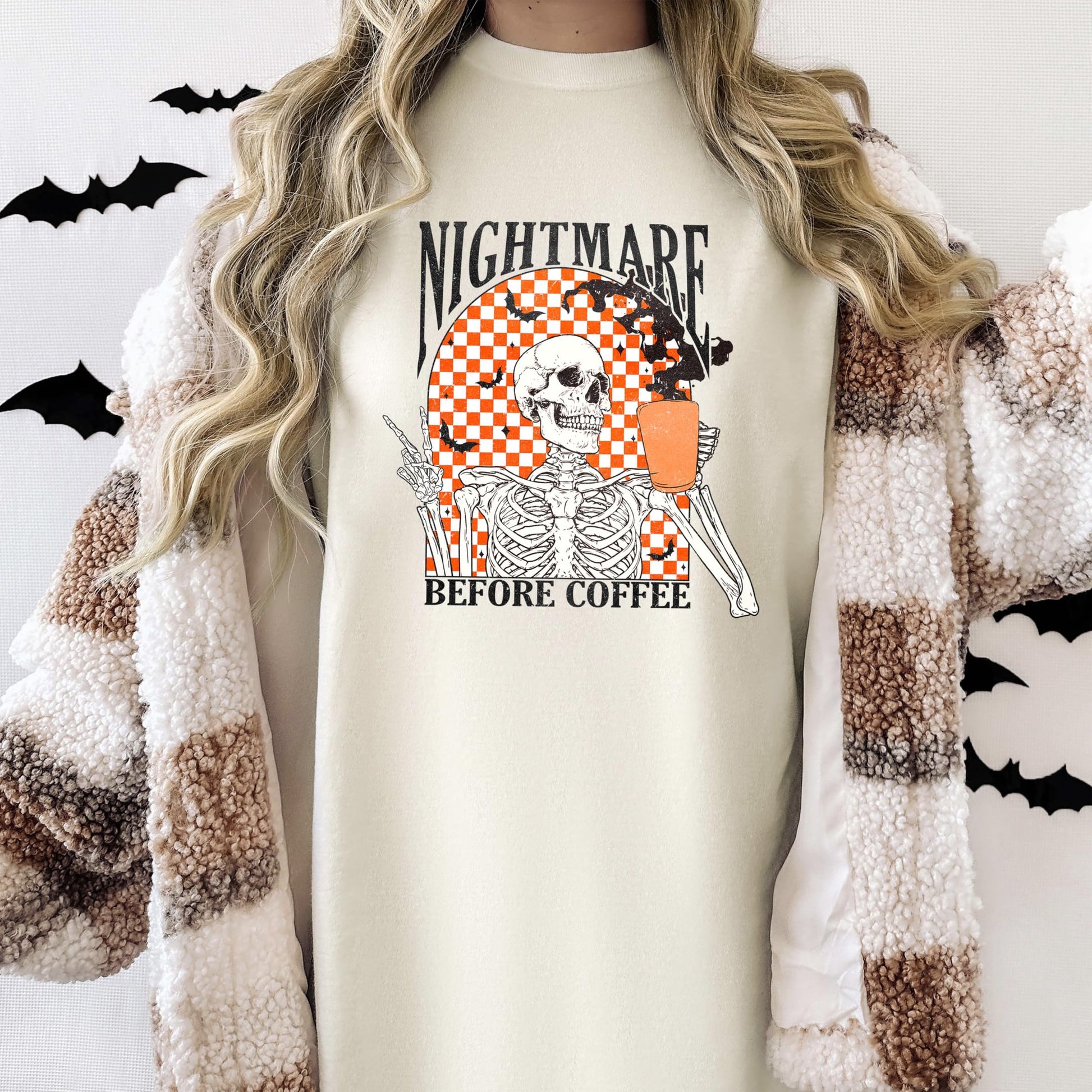 Close-up of Nightmare Before Coffee vintage skeleton graphic print on seafoam women's Halloween t-shirt