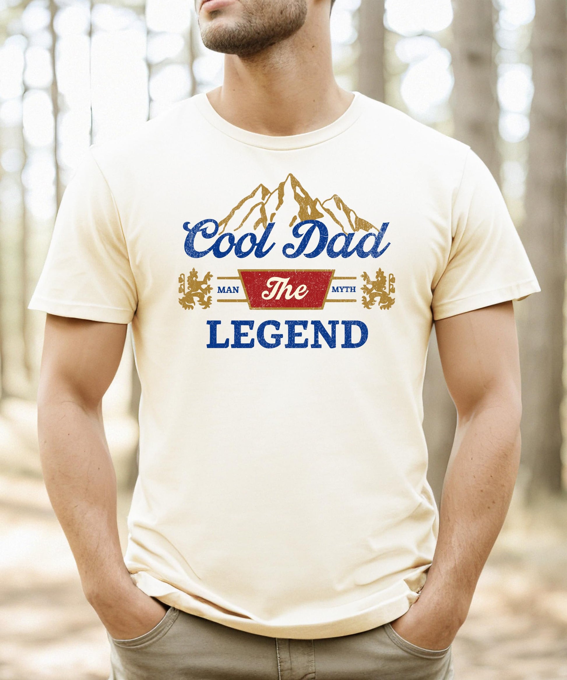 Close-up of Man Myth Legend typography and mountain graphic print on black tee