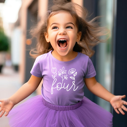 Close-up of 'Four' floral graphic print on toddler birthday shirt