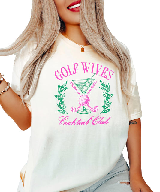 Front view of Golf Wives Cocktail Club women's graphic tee in ivory with bold cocktail and golf club design