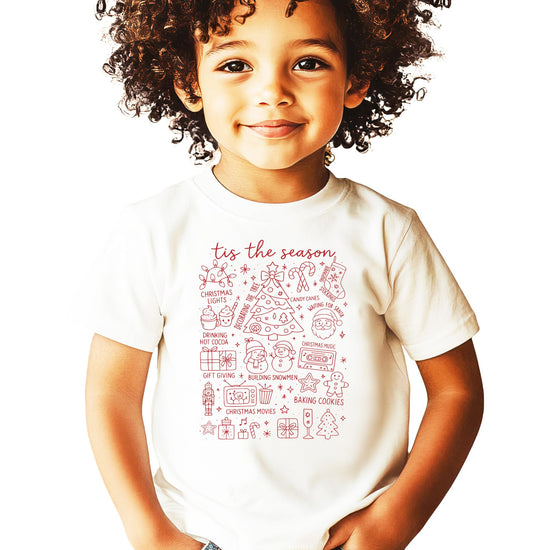 Lifestyle flat lay of Tis the Season Christmas family matching tee in natural color
