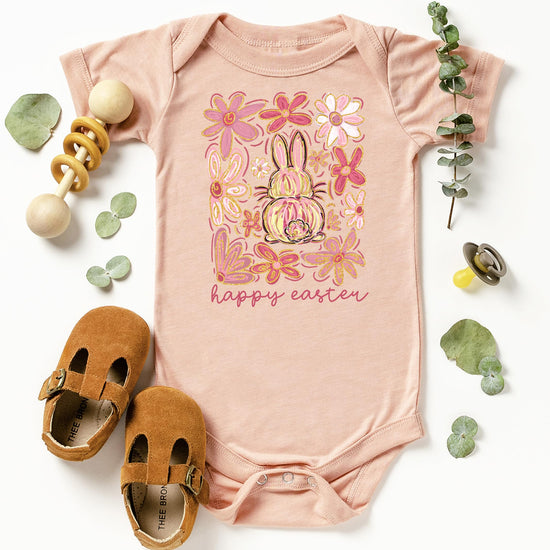 Olive Loves Apple boho Easter baby bodysuit hanging display with spring floral bunny design