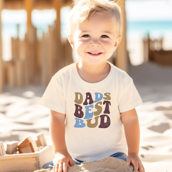 Toddler wearing retro Dad's Best Bud natural graphic tee, front view