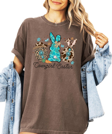 Women's espresso brown graphic tee with cowgirl Easter bunnies design featuring cow print hat and rope-style font