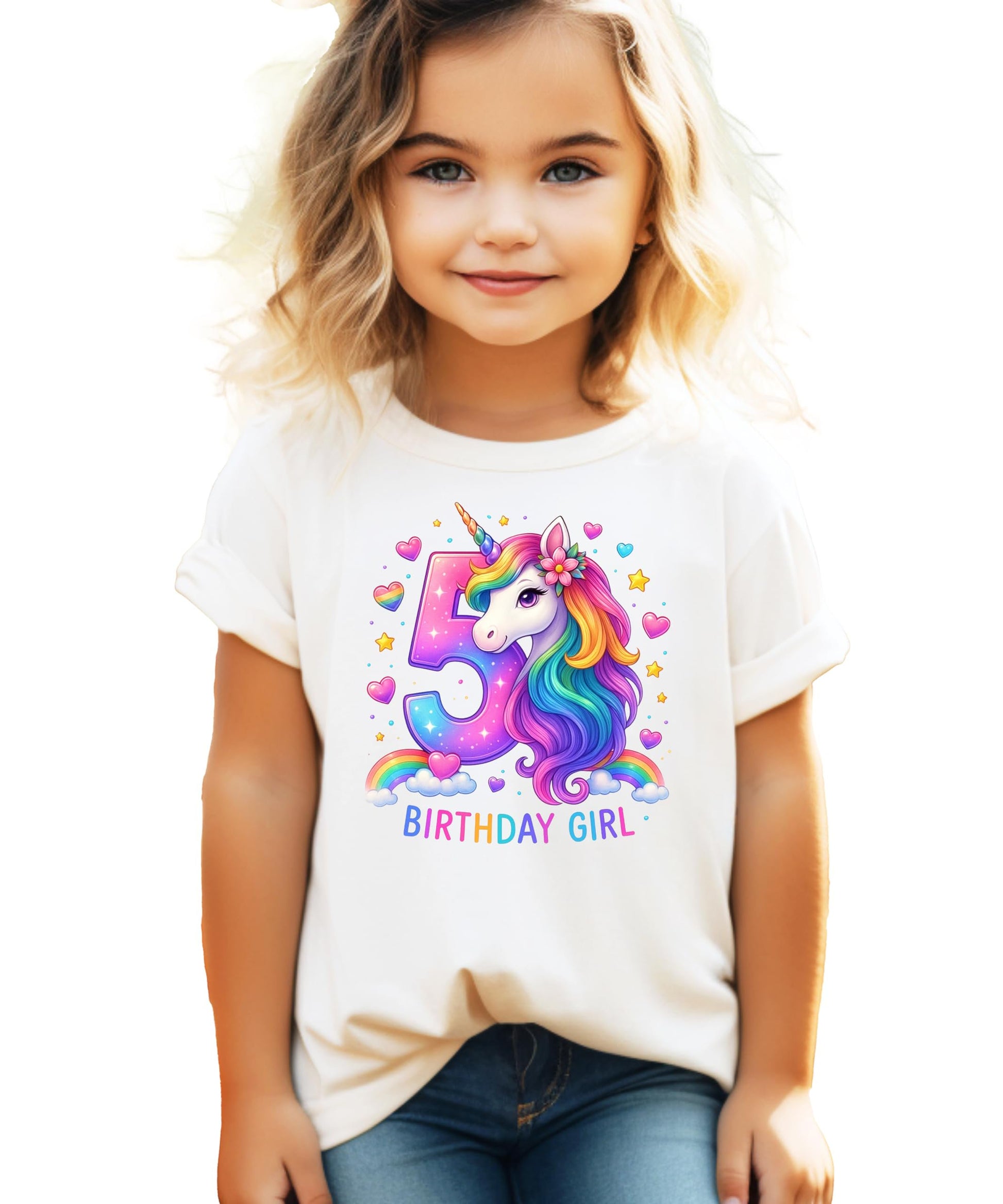 Close-up of vibrant rainbow unicorn print with hearts and stars on pink birthday shirt