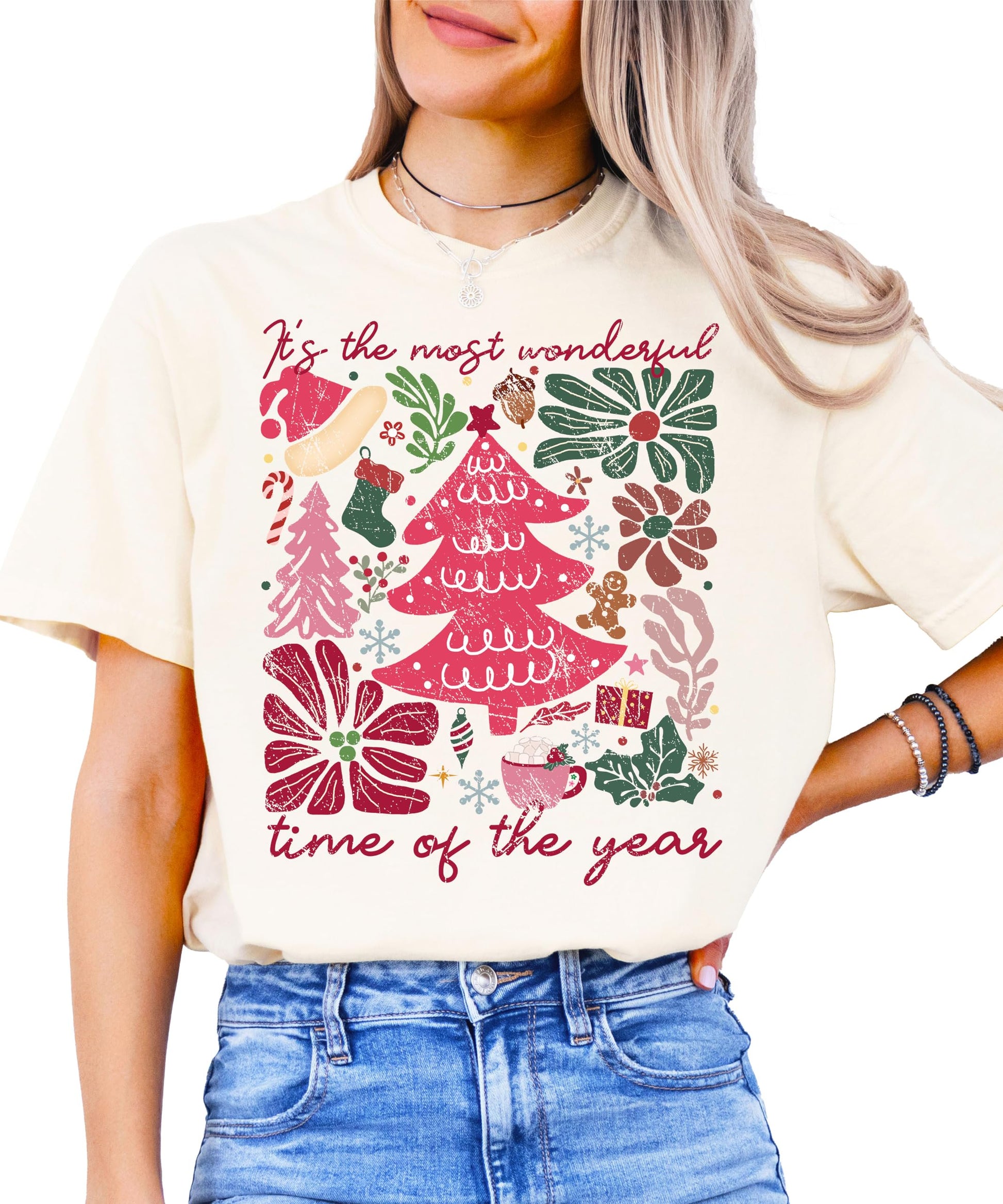 Close-up of holiday collage graphic print on ivory women's Christmas tee