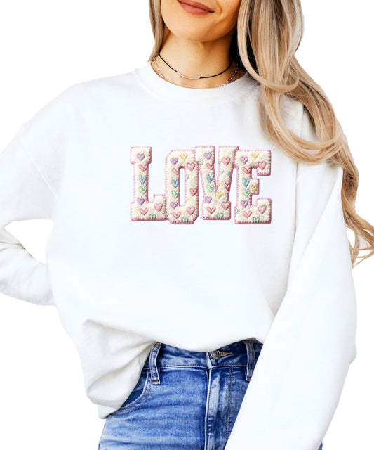 Girly retro pink pullover sweatshirt with ink-printed LOVE graphic and pastel heart details