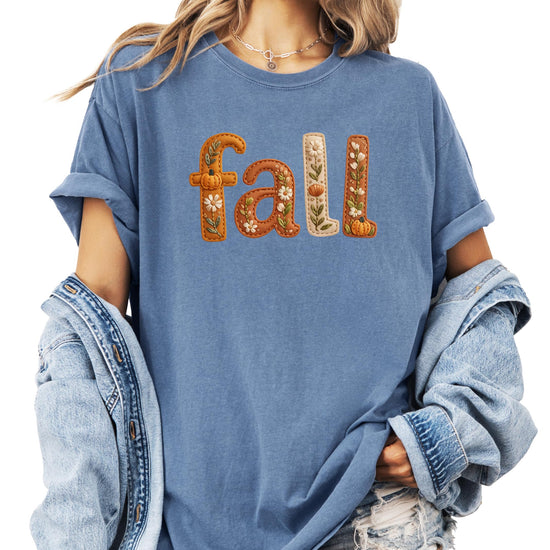 Women's fall tee flat lay showing full autumn graphic design